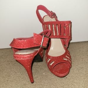 Red sparkle platform heel.